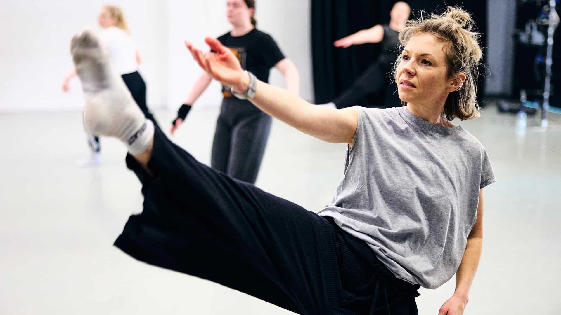 Dance teacher teaching dance students