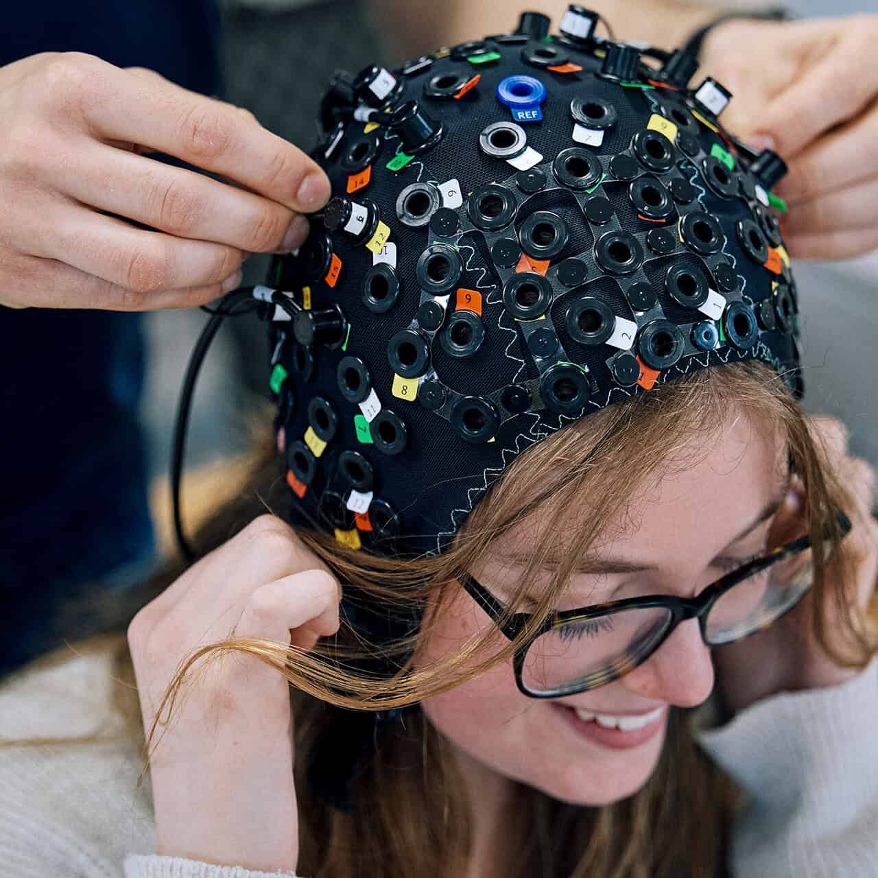 Student demonstrating psychology equipment use