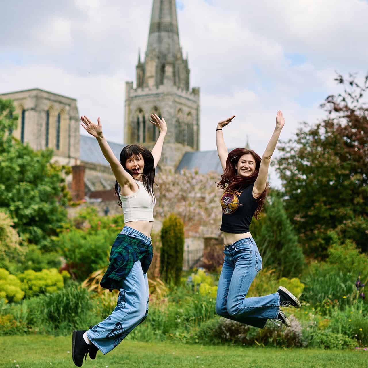 Students jumping in Bishop Palace Gardens